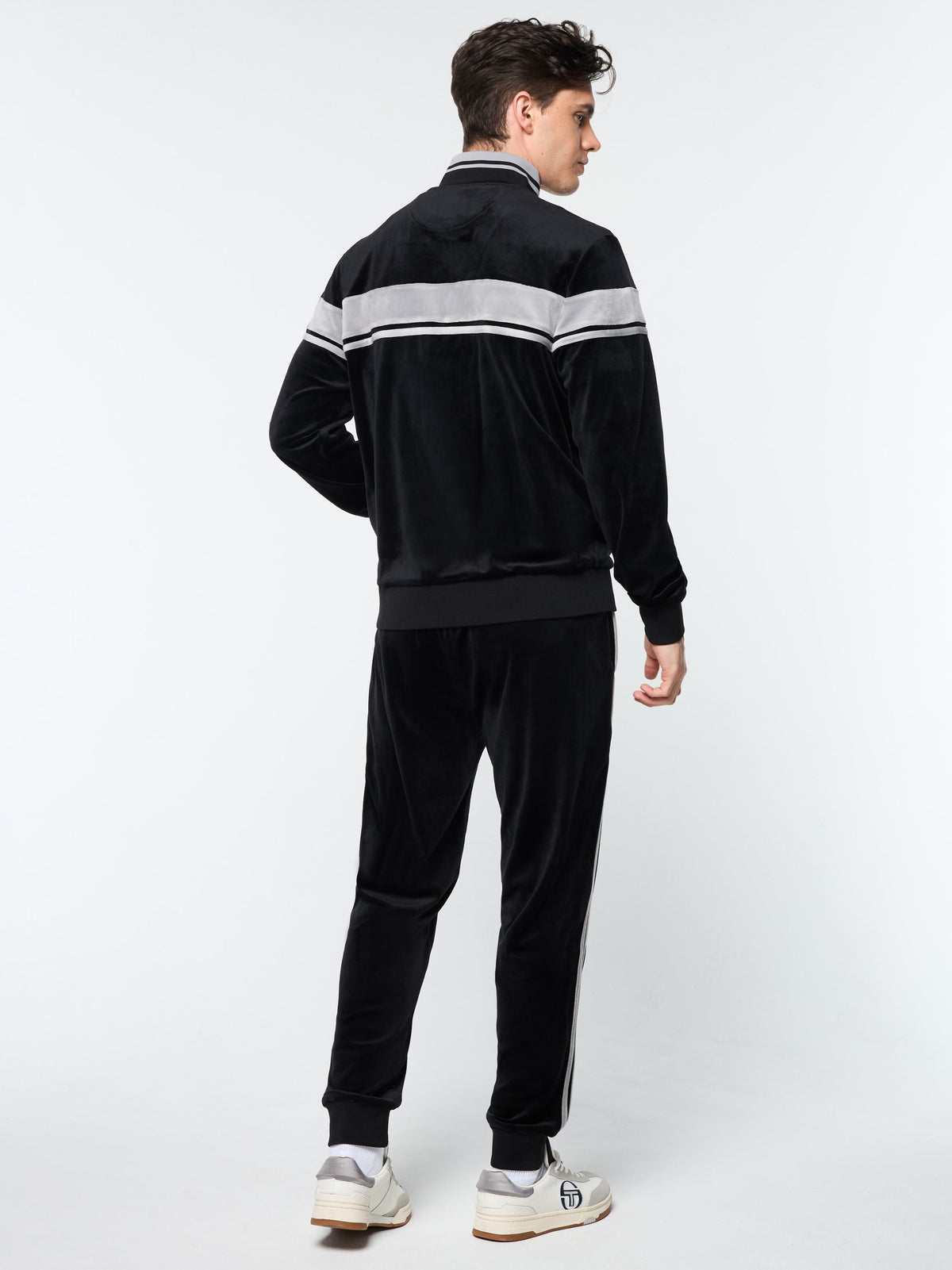 Back view of the Damarindo Velour Track Jacket and pants in Black Beauty.