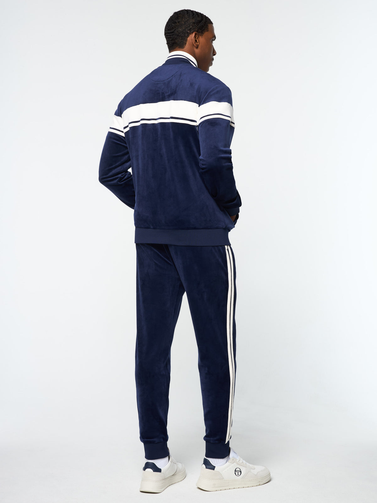 Back view of the Damarindo Velour Track Jacket and pants in Maritime Blue.