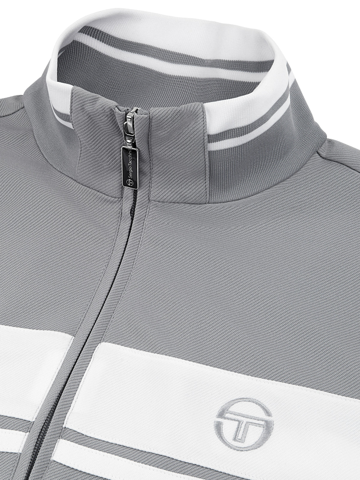 Close-up of the collar, zip pull, and chest stripe on the Damarindo Track Jacket Archivio in Sleet/White.
