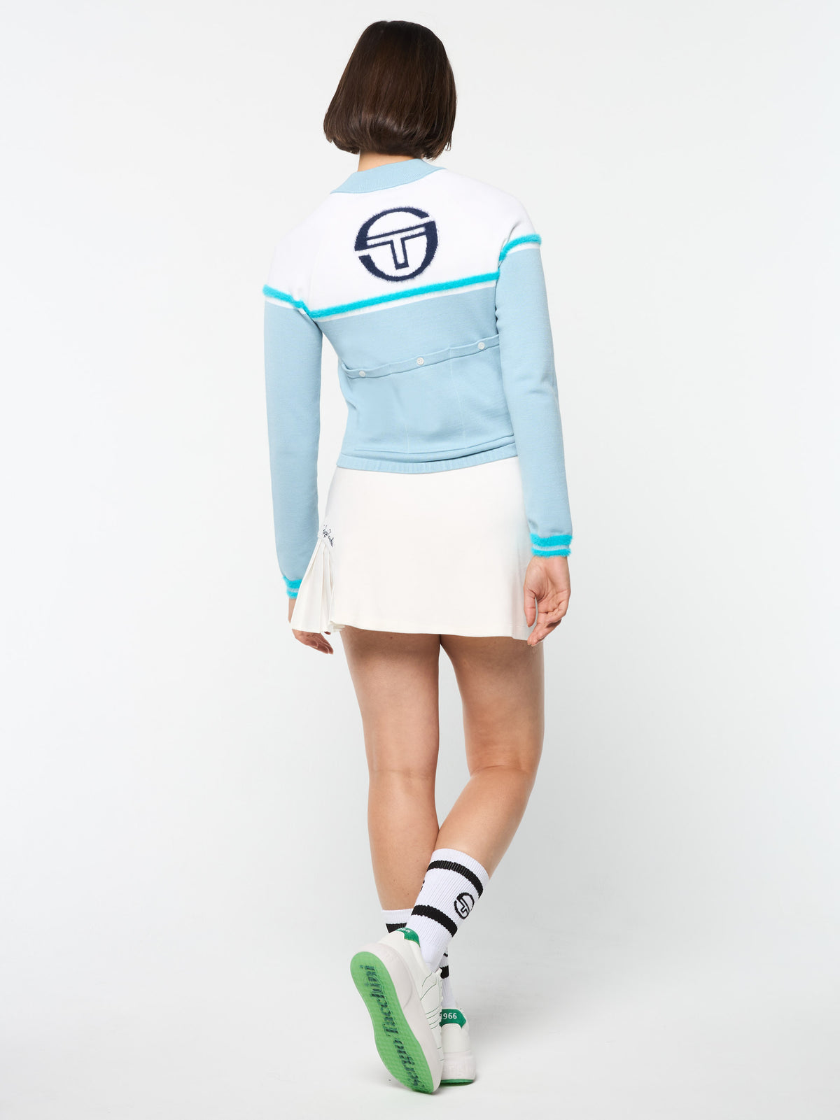 Full body back view of the Ruota Cycling Jersey in Celestial Blue, walking pose.