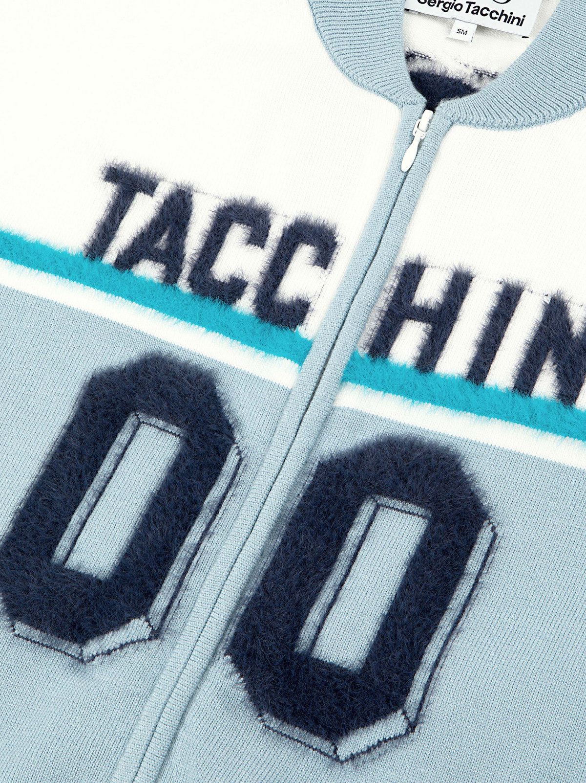 Close-up of the textured "00" graphic and zip on the Ruota Cycling Jersey in Celestial Blue.