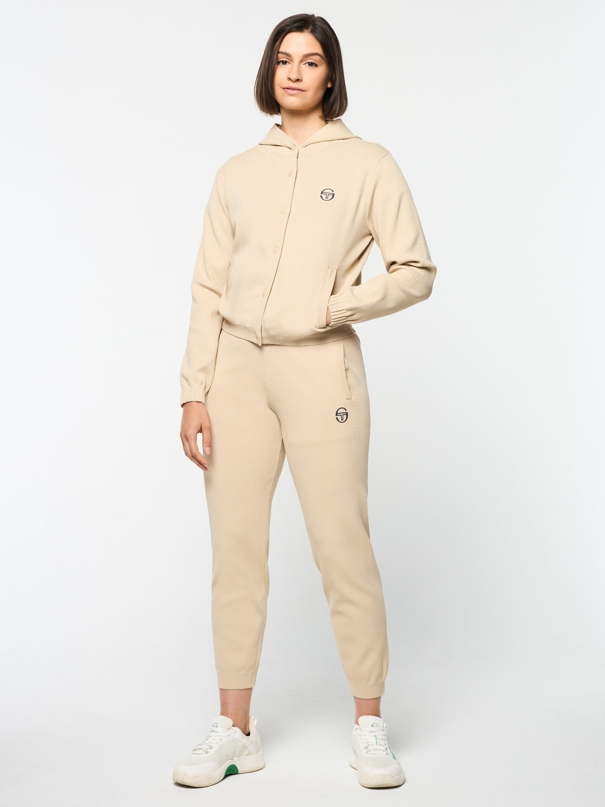 Model wearing the Rosolina Hoodie in Humus with matching joggers, full body front view.