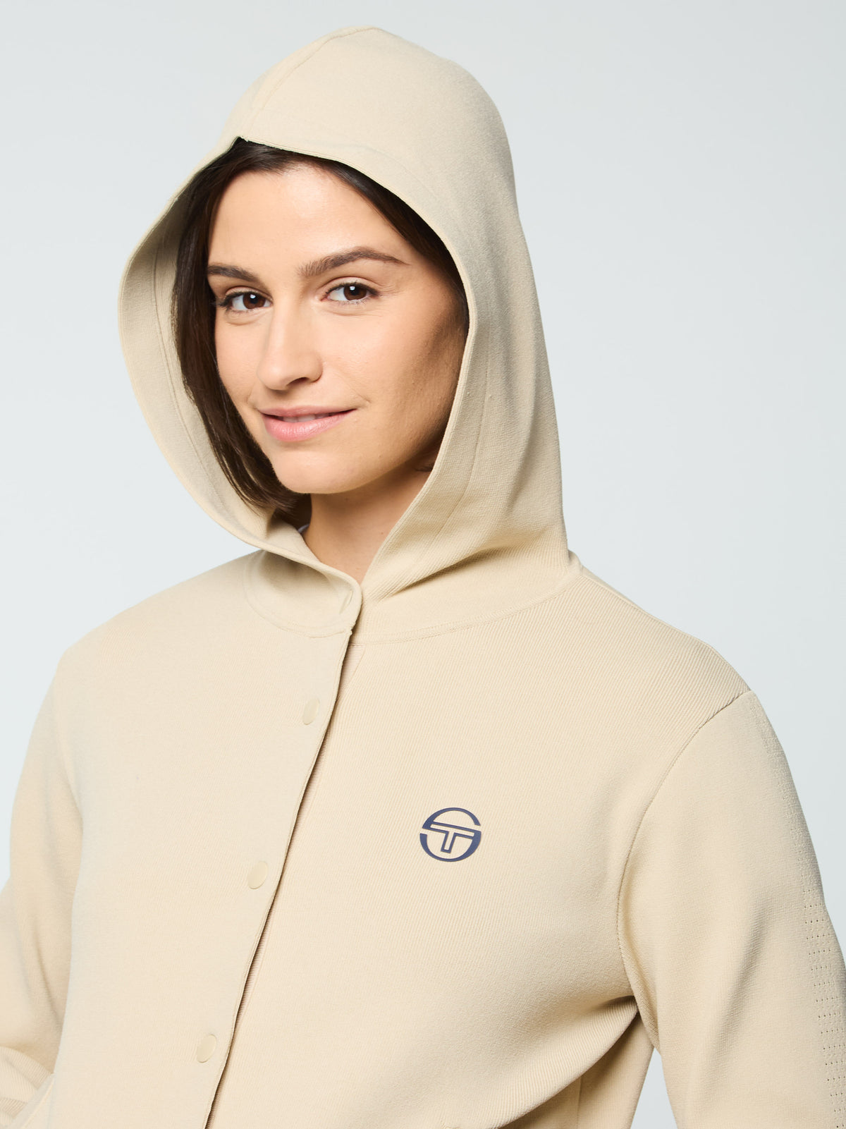 Close-up portrait of the button placket and Sergio Tacchini logo on the Rosolina Hoodie in Humus.