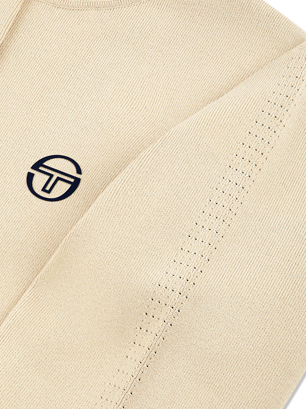 Close-up of the embroidered logo and knit texture on the Rosolina Hoodie in Humus.