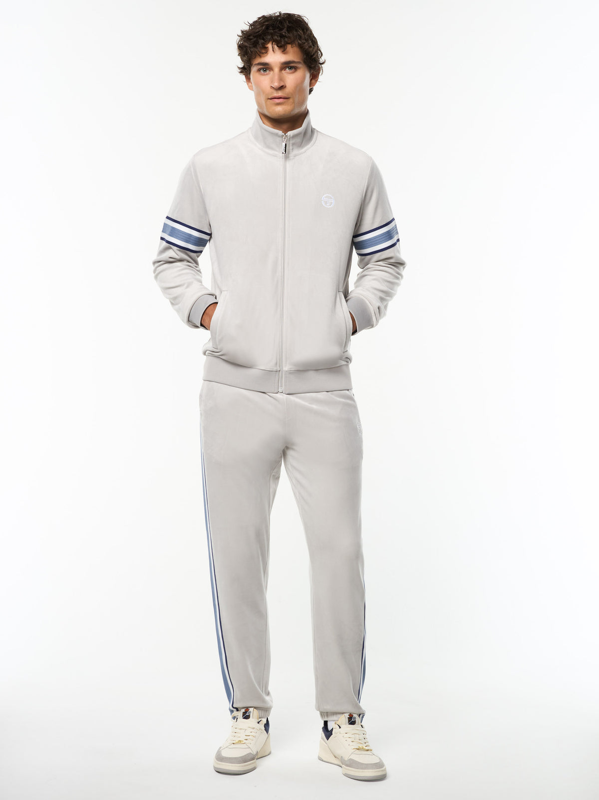Model wearing the Linera Velour Track Jacket and matching pants in Quiet Gray, full body front view.