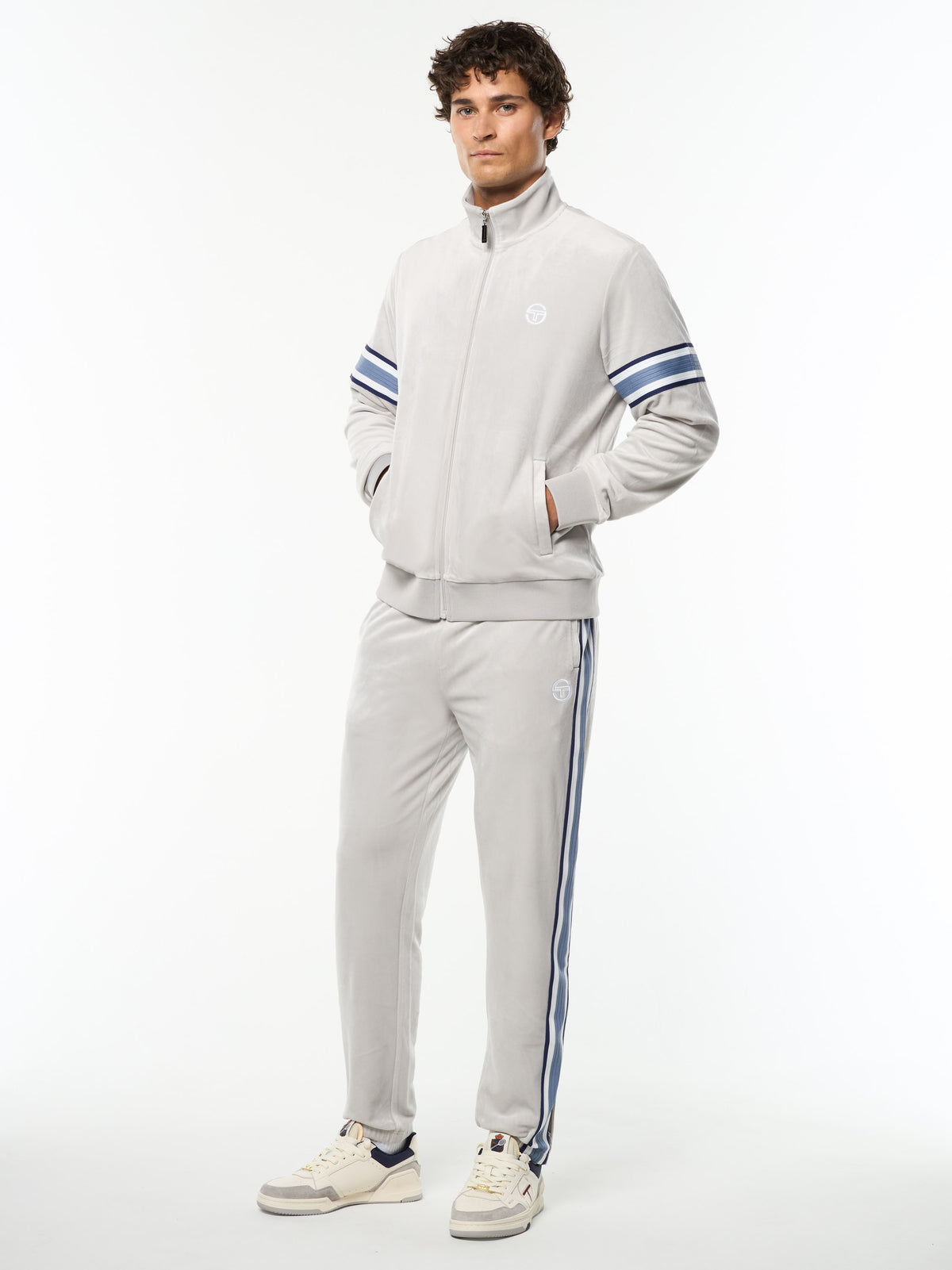 Full body angled view of the Linera Velour Track Jacket and matching striped pants in Quiet Gray.