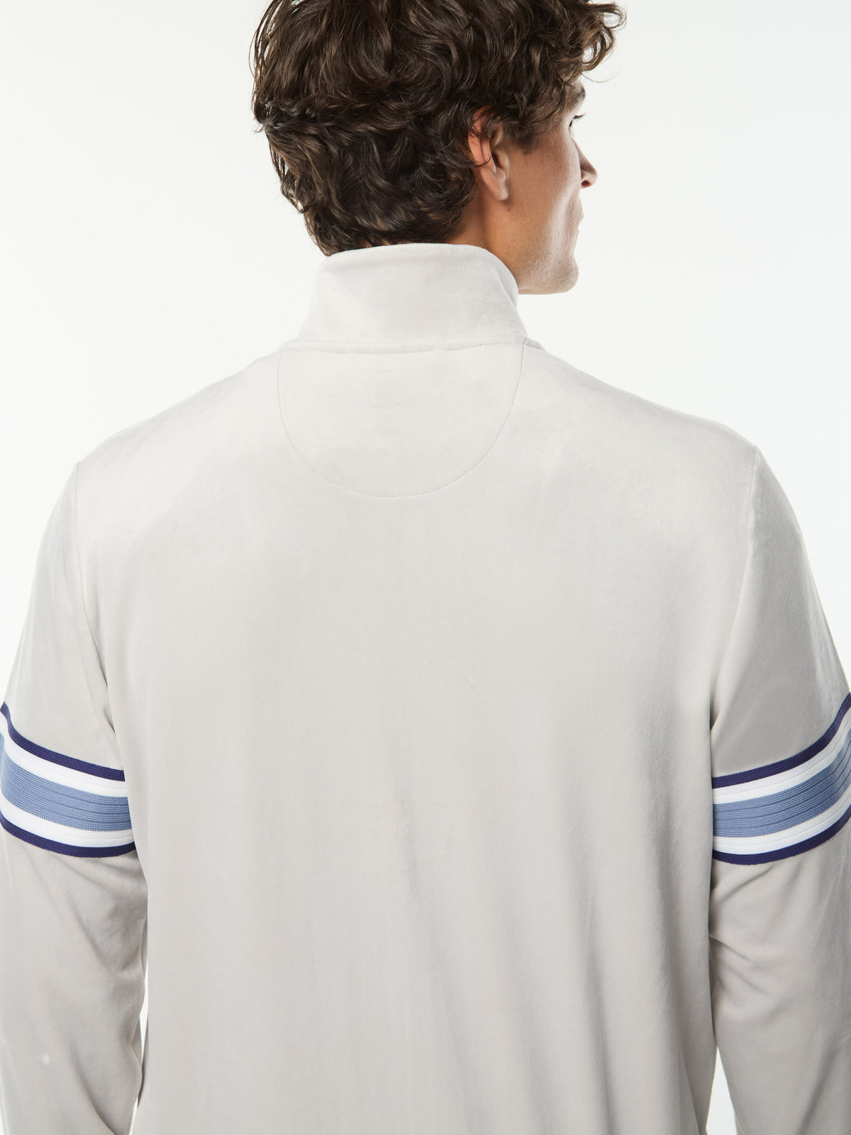 Close-up back view of the collar and blue sleeve stripes on the Linera Velour Track Jacket in Quiet Gray.