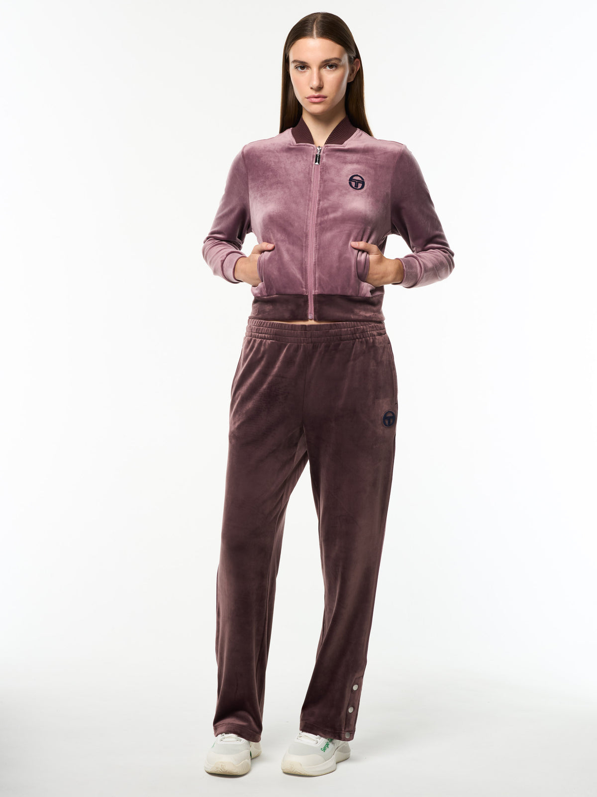 Model wearing the Dalia Velour Track Jacket in Grape Shake with matching wide-leg velour pants, full body front view.