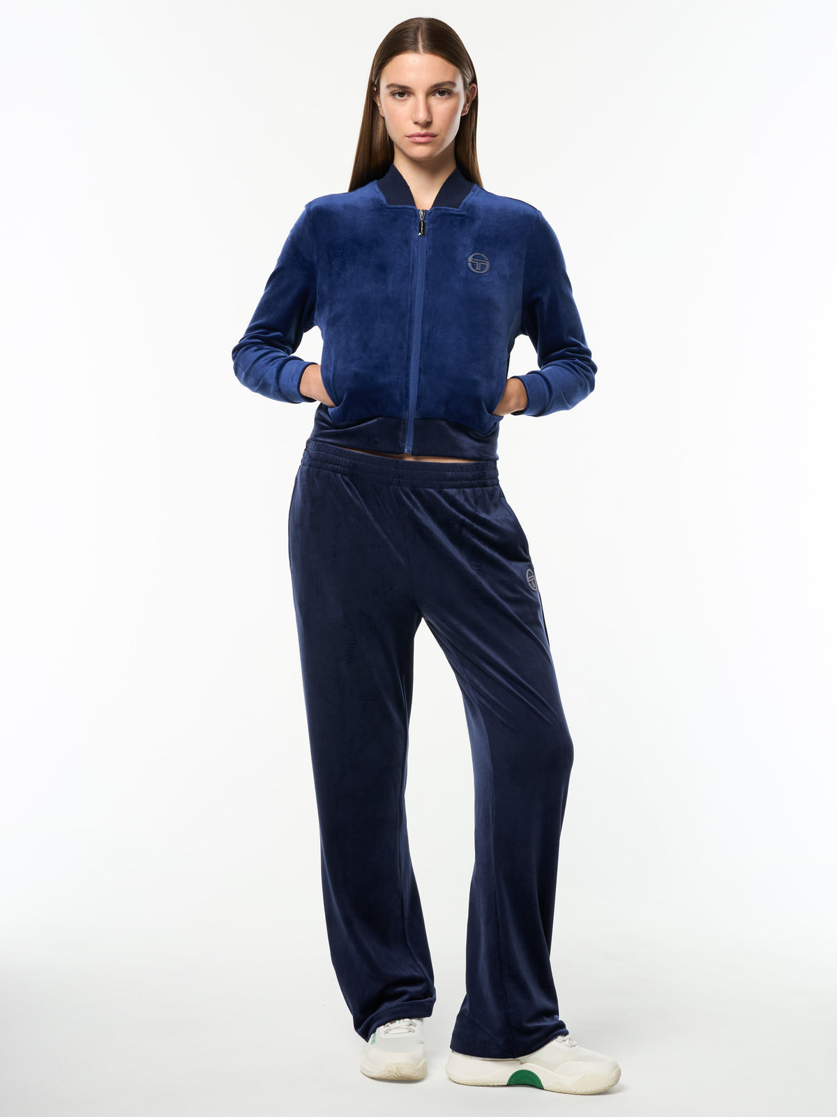 Model wearing the Dalia Velour Track Jacket in Beacon Blue with matching wide-leg velour pants, full body front view.