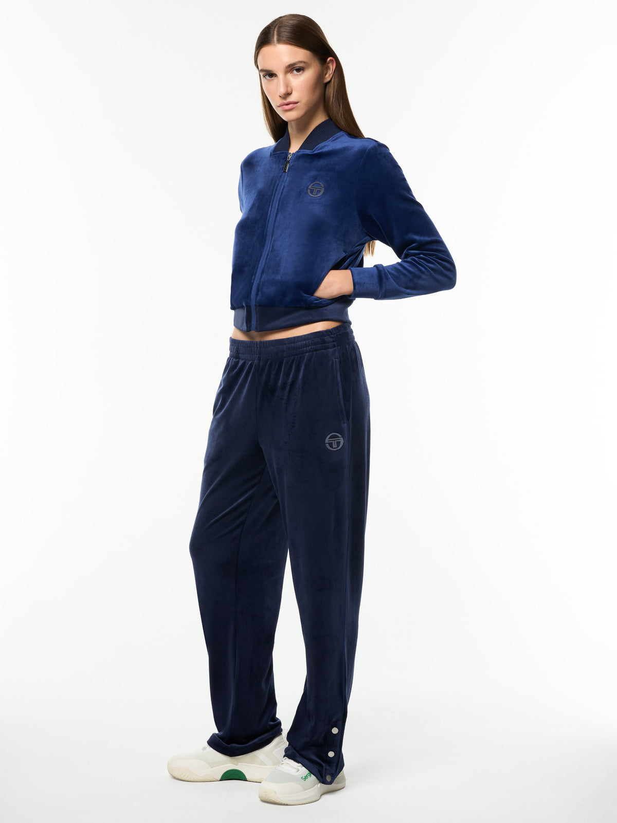 Full body angled view of the Dalia Velour Track Jacket and matching pants in Beacon Blue.