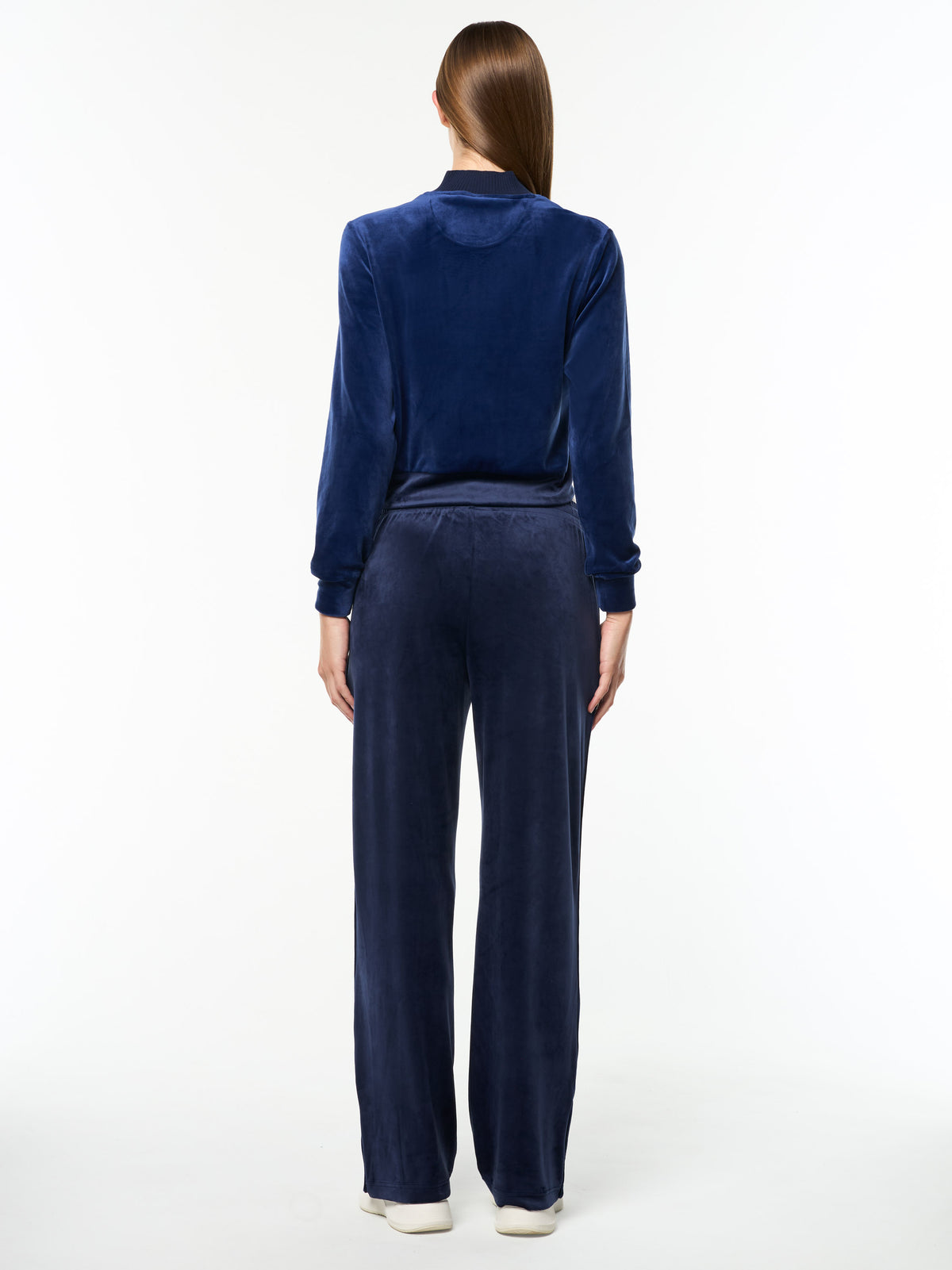 Full body back view of the Dalia Velour Track Jacket and matching pants in Beacon Blue.
