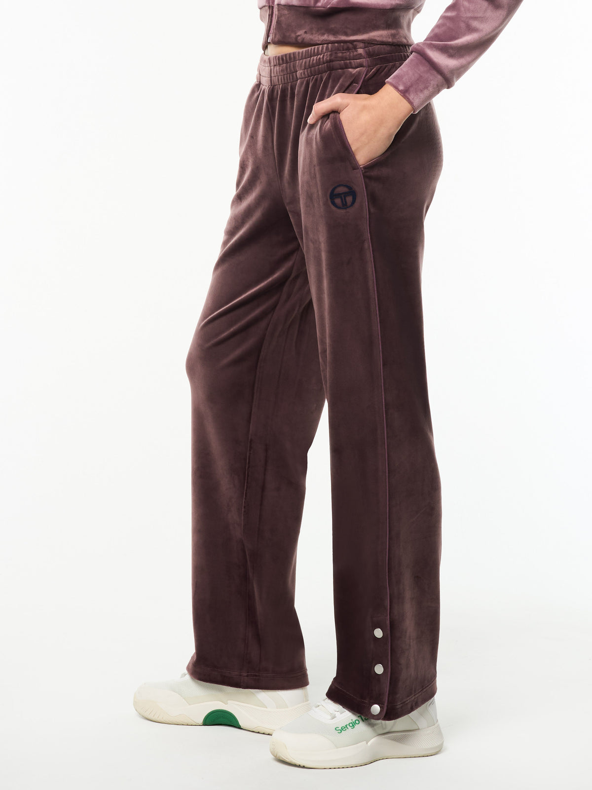 Side view of the Dalia Velour Track Pant in Huckleberry, a straight-leg velour pant with snap-button hems.