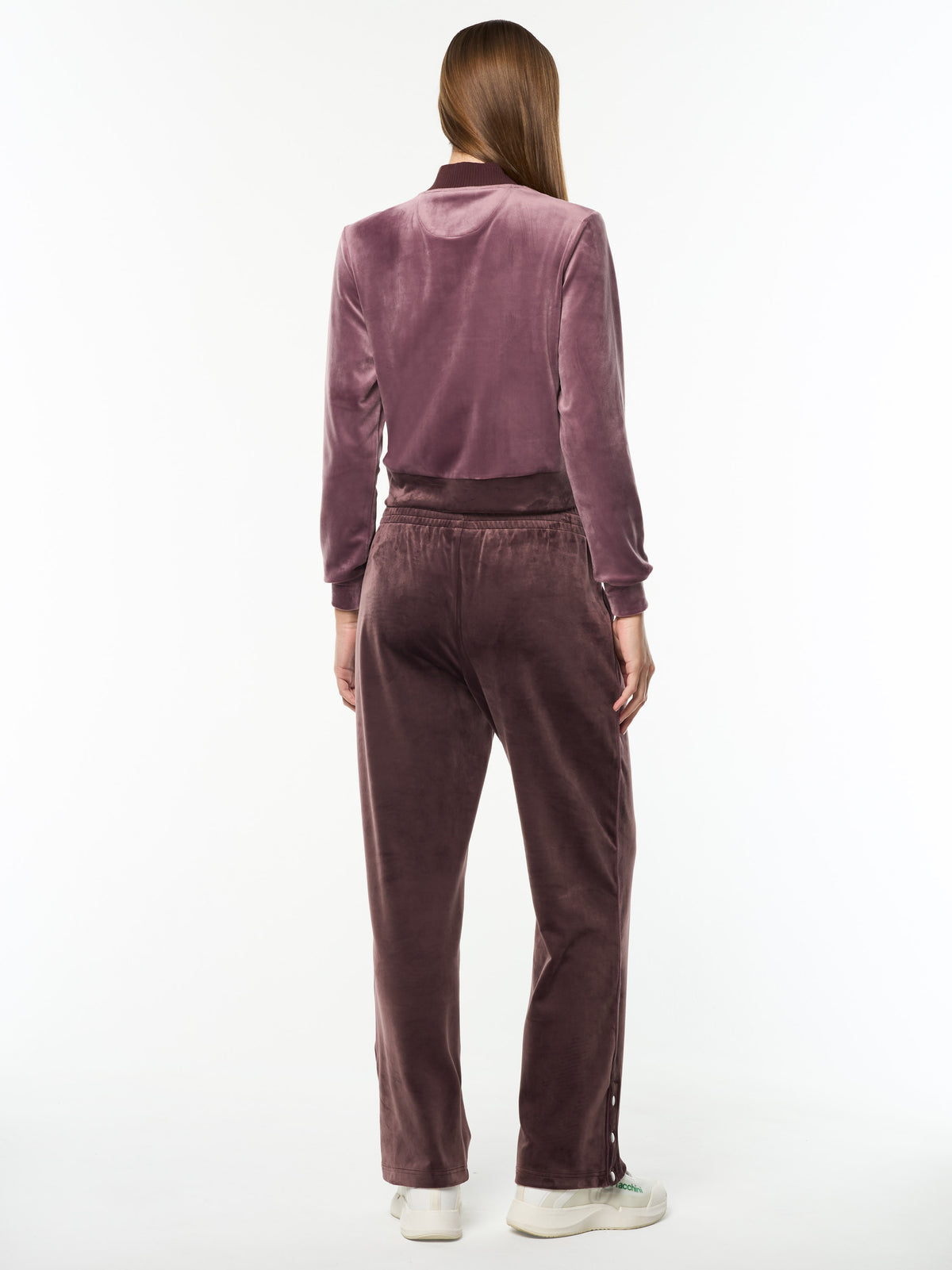 Full body back view of the Dalia Velour Track Pant in Huckleberry with a matching cropped velour jacket.