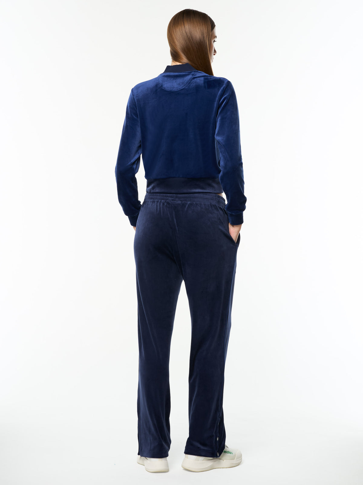Full body back view of the Dalia Velour Track Pant and matching jacket in Maritime Blue.
