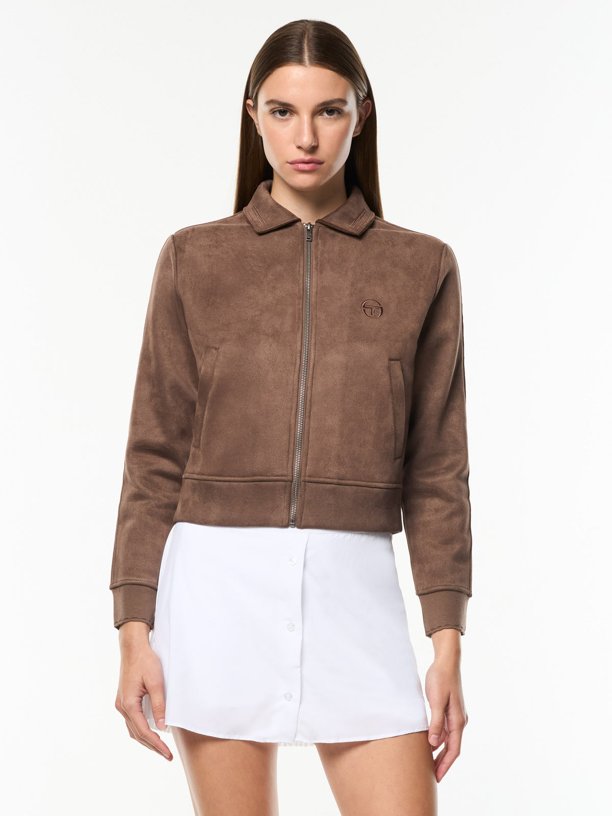 Model wearing the Women's Soffice Track Jacket in Chocolate Chip, a cropped suede-feel zip jacket with collar, front view.