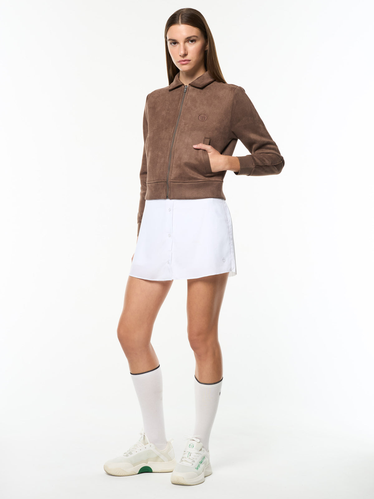 Full body angled view of the Women's Soffice Track Jacket in Chocolate Chip with a white skirt.