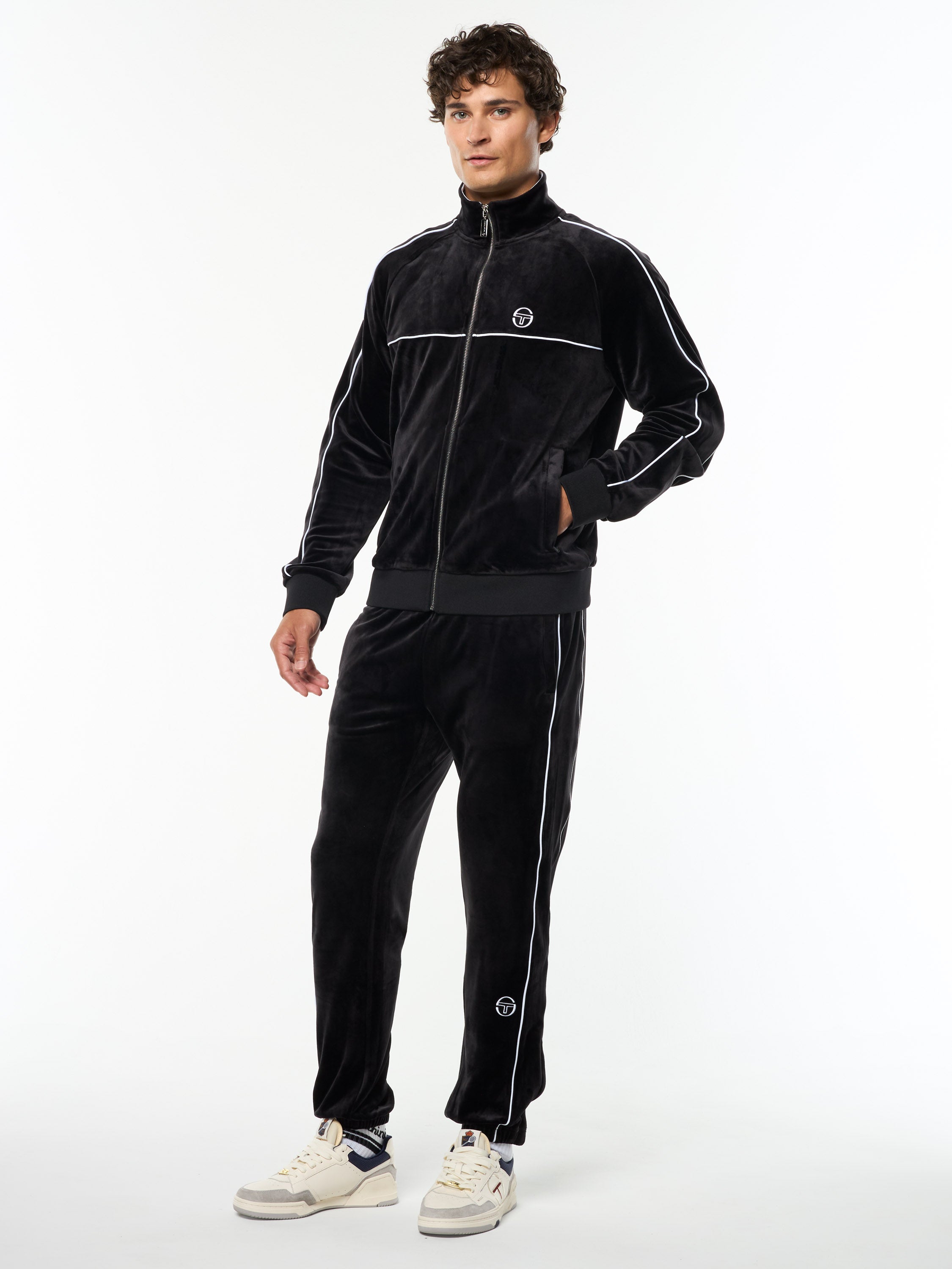 Full body angled view of the Lioni Velour Track Jacket and matching pants in Black Beauty.
