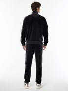 Full body back view of the Lioni Velour Track Jacket and matching pants in Black Beauty.