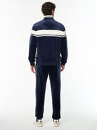 Full body back view of the Damarindo Velour Track Jacket and matching pants in Maritime Blue.