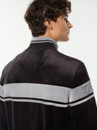 Close-up back view of the collar and gray stripe on the Damarindo Velour Track Jacket in Black Beauty.